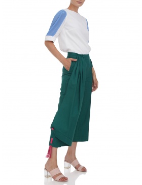 Cropped trousers with leather tassels 